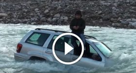 SUV CROSSES THE RIVER