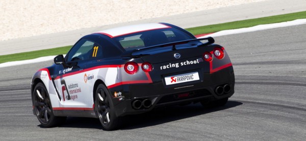 2010_nissan_gtr_with_akrapovic_evolution_exhaust_system_at_portimao_circuit_rear three quarter