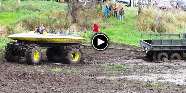 Boat On Monster Wheels Pulling An Army Truck