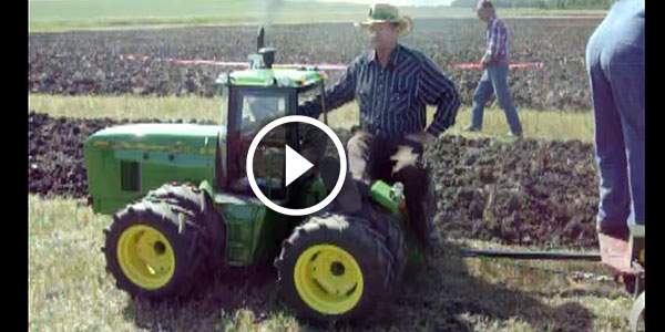 Scaled John Deere plowing