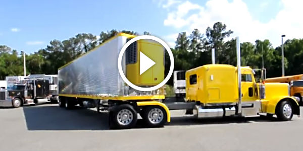 Professional driver jackknifing a 53 foot trailer into a parking space