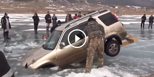 How to pull out car from a frozen lake. Russian style