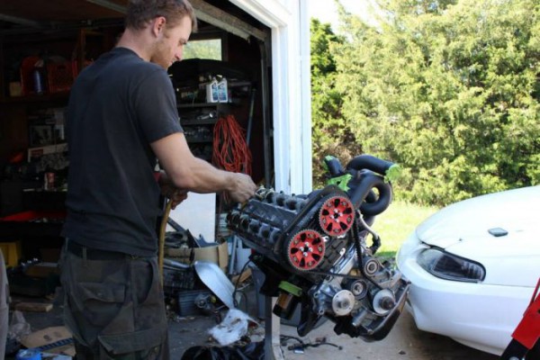 robert bell working on an engine