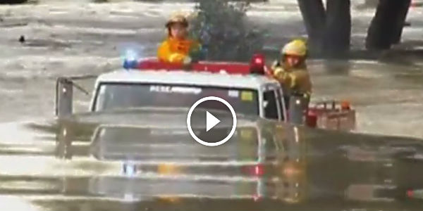 Fire truck drives through 11ft flood