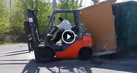 crazy guy destroys a barrack with fork lift