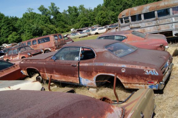 1971-plymouth-duster in a junkyard at carolina hills