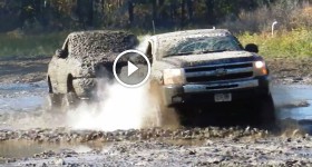 Lifted 2010 Chevy Pulls a Lifted Ford Through a Big Mudhole