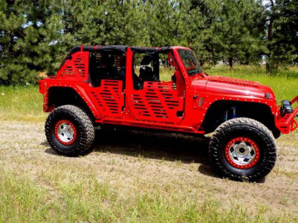 jk skinz jeep with tires side view on the road