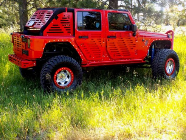 jk skinz jeep with tracks side rear three quarters