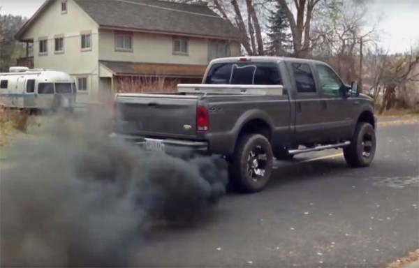 rolling coal with pickup rear three quarters