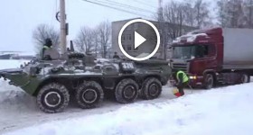 BTR 80 APC rescues truck stuck in snow in Russia