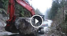 Wrestling a big Rock near a big cliff