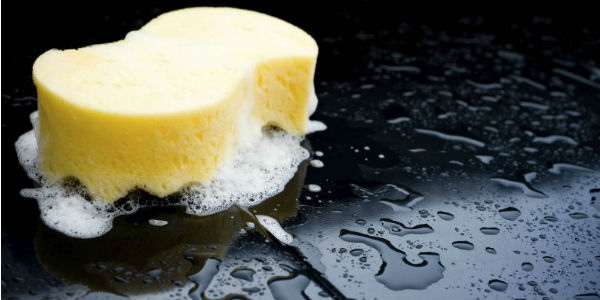 hand-washing a car with a sponge - cl