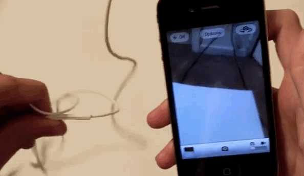 take a picture using the headphones button
