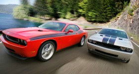 two 2010 dodge challenger cars front end in motion - cl