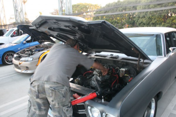 Dom Toretto's 1970 Primer Chevrolet Chevelle SS working on the engine