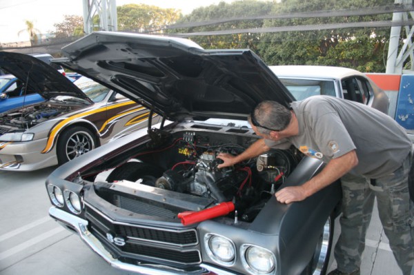Dom Toretto's 1970 Primer Chevrolet Chevelle SS working under the hood close up