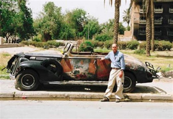 Uday Hussein's burned old car side view