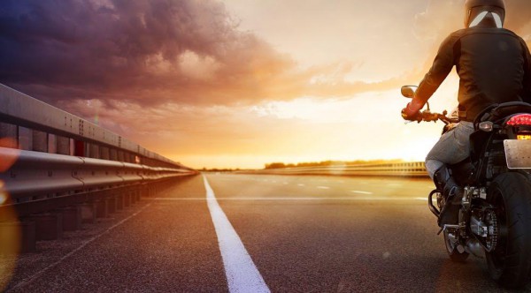 biker-on-the-road-with-sunset-ahead
