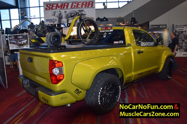 customized-toyota-tundra-with-trike-in-the-back-at-sema-2016-rear-three-quarters
